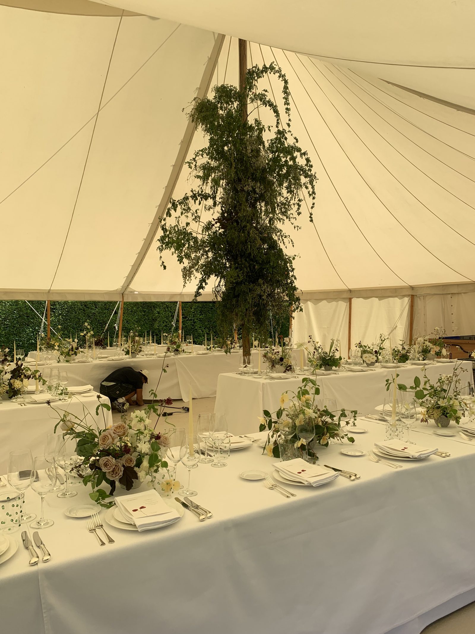 Hanging greenery installation in a marquee